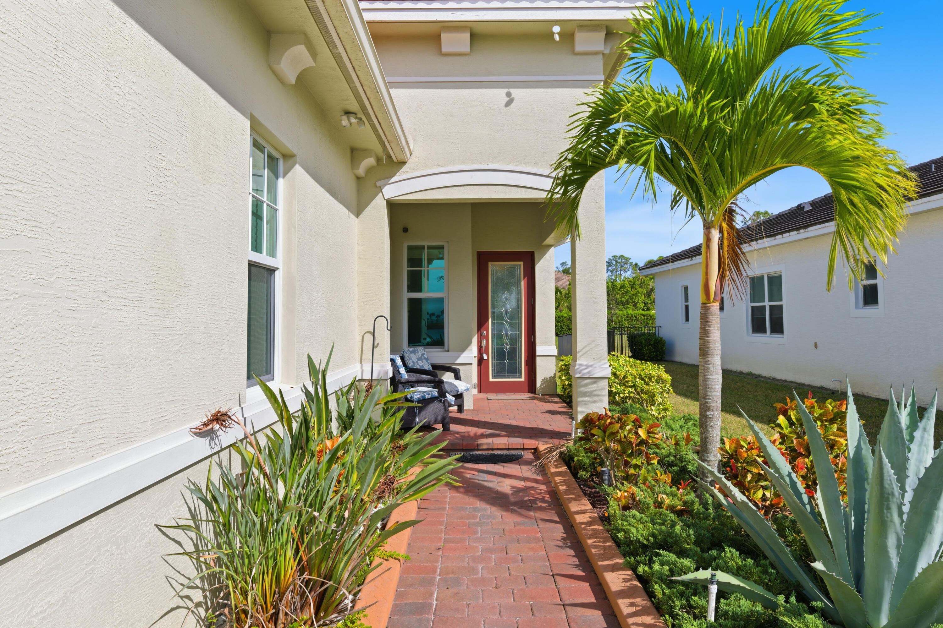 11473 Southwest Visconti Way Port St. Lucie, FL 34986 - Photo 5 of 69 a view of a house with fountain bath tub and potted plants