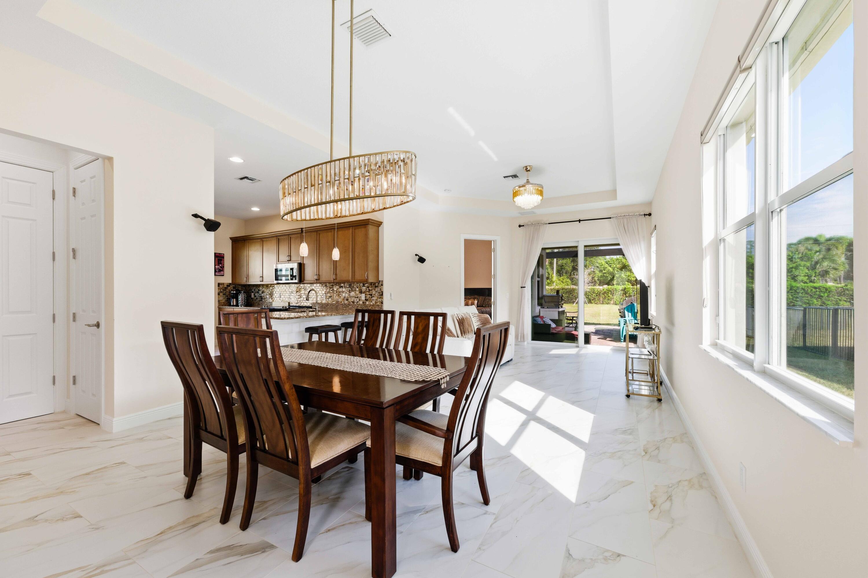11473 Southwest Visconti Way Port St. Lucie, FL 34986 - Photo 6 of 69 a dining room with furniture and window