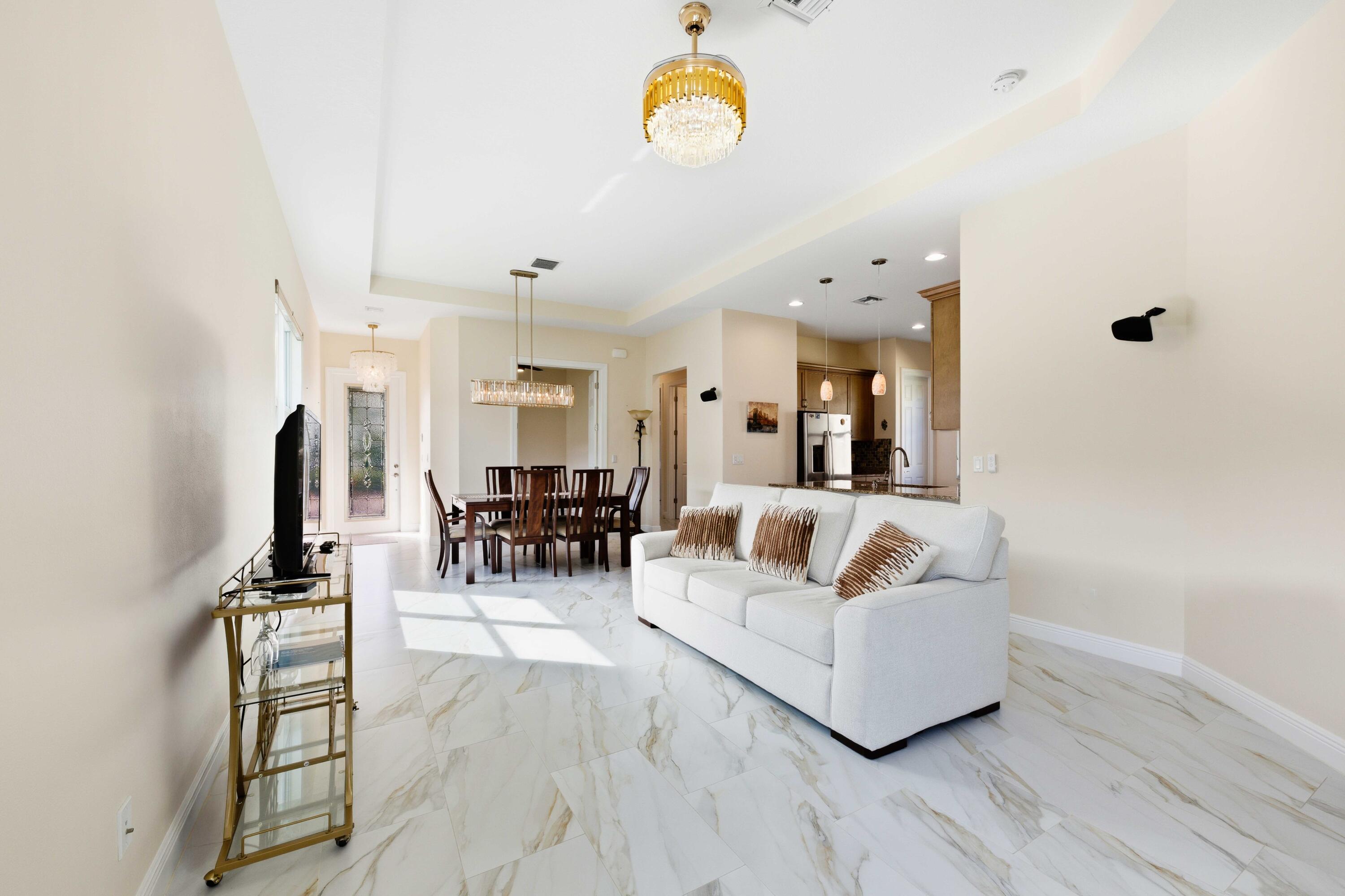 11473 Southwest Visconti Way Port St. Lucie, FL 34986 - Photo 9 of 69 a living room with furniture and wooden floor
