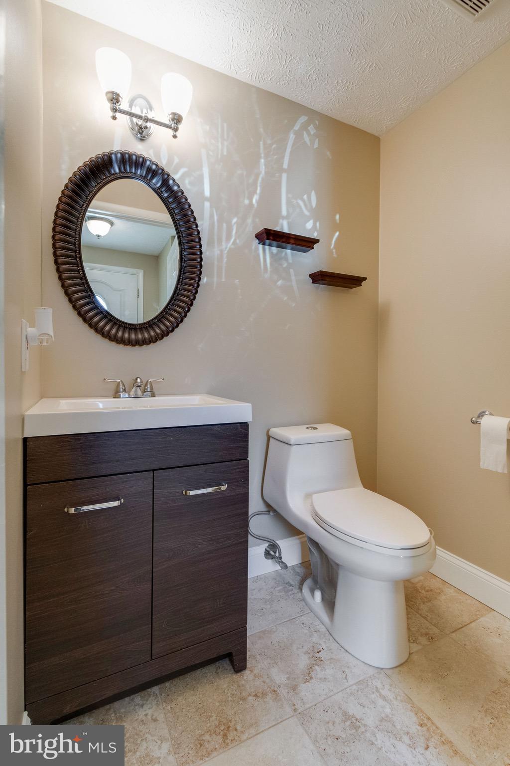 8044 Steeple Chase Court Springfield, VA 22153 - Photo 9 of 25 Updated Half Bathroom on Main Level
