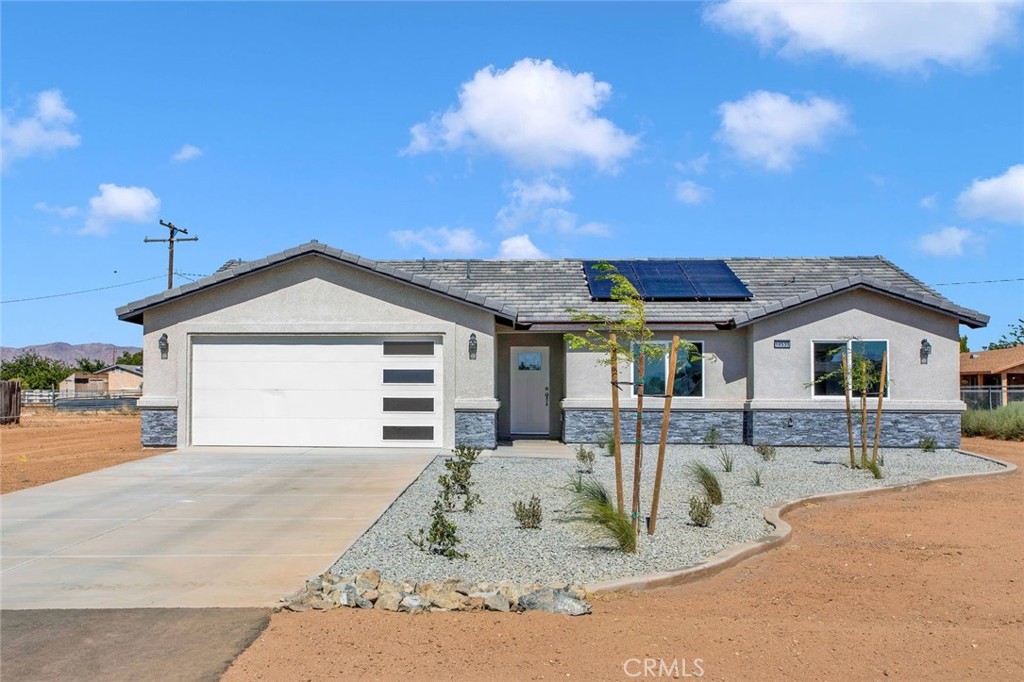 10533 Mohawk Road Apple Valley, CA 92308 - Photo 1 of 1 a view of a house with a patio