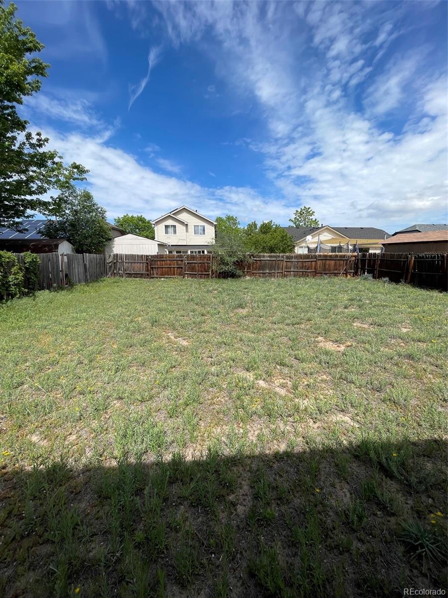 4841 Carson Street Denver, CO 80239 - Photo 11 of 12 a view of a field with an ocean