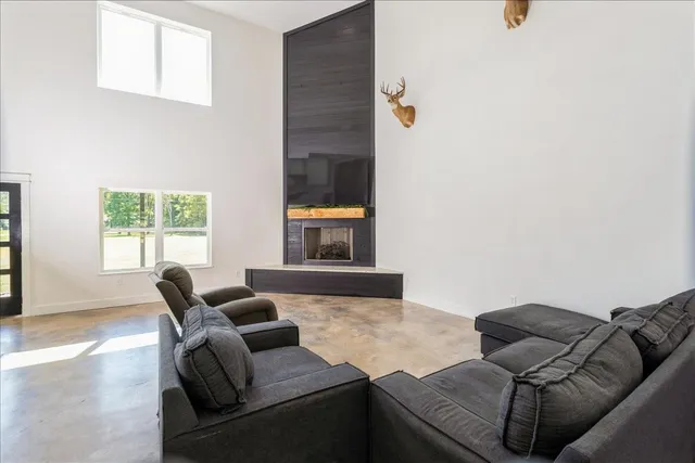 a living room with furniture and a window