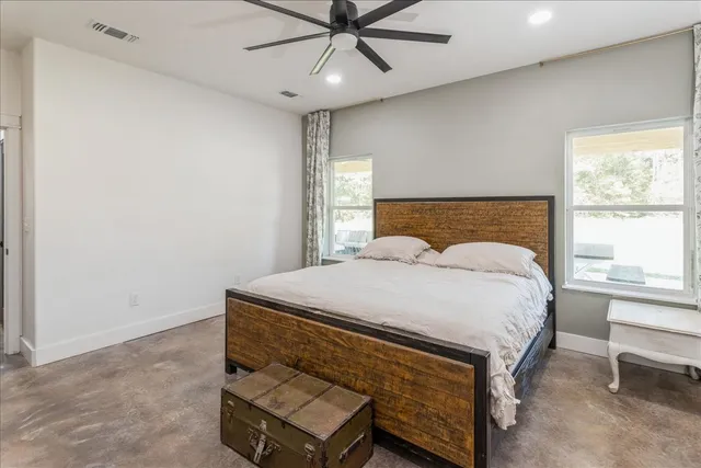 a bedroom with a bed and window