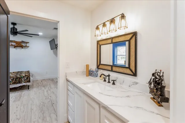a bathroom with a sink and a mirror