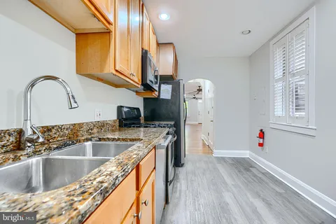 a view of a kitchen cabinets and stainless steel appliances