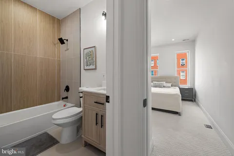 a bathroom with a toilet sink and shower