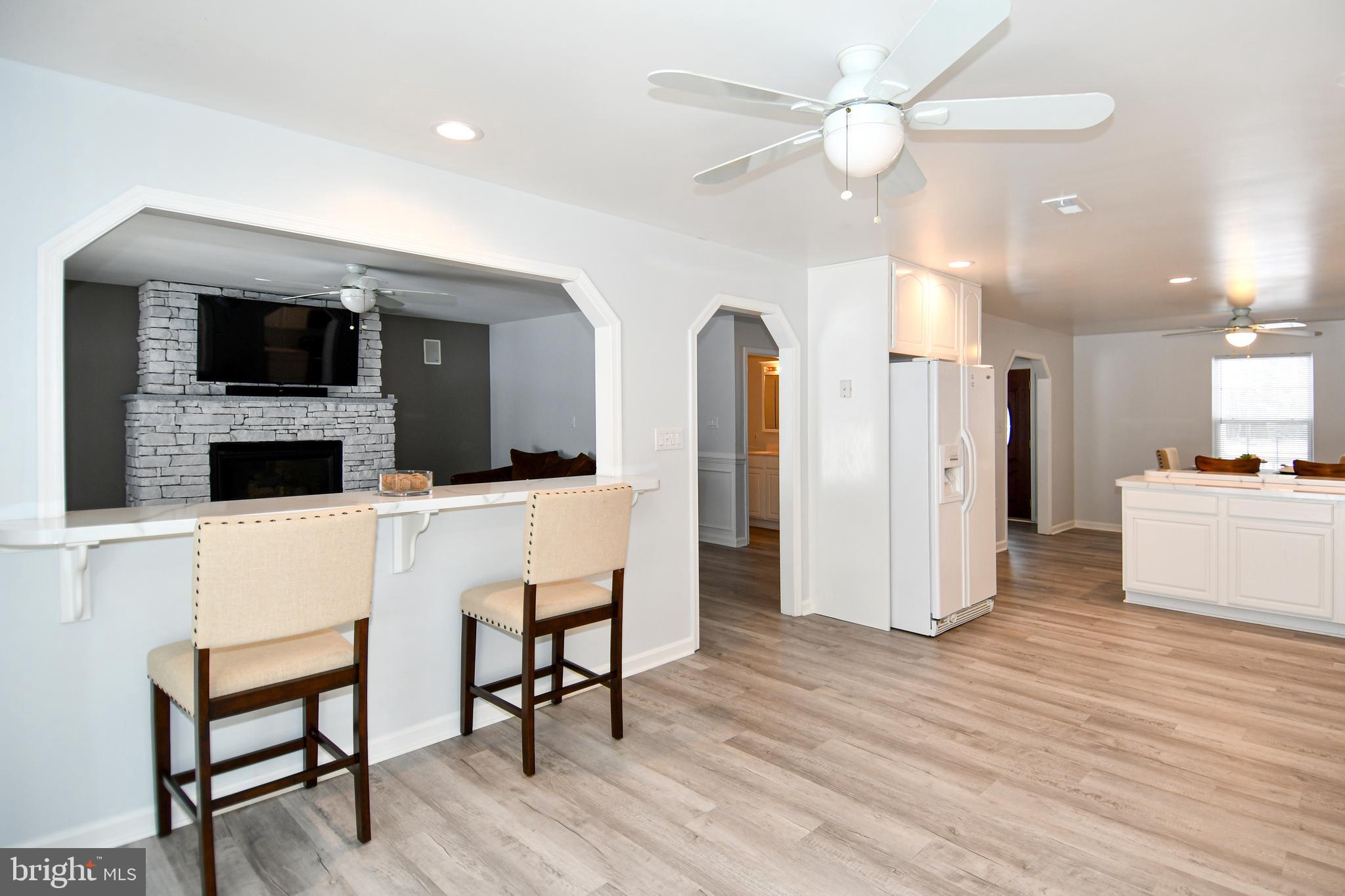 10049 Meleen Drive Faulkner, MD 20632 - Photo 14 of 56 a living room with furniture and a flat screen tv
