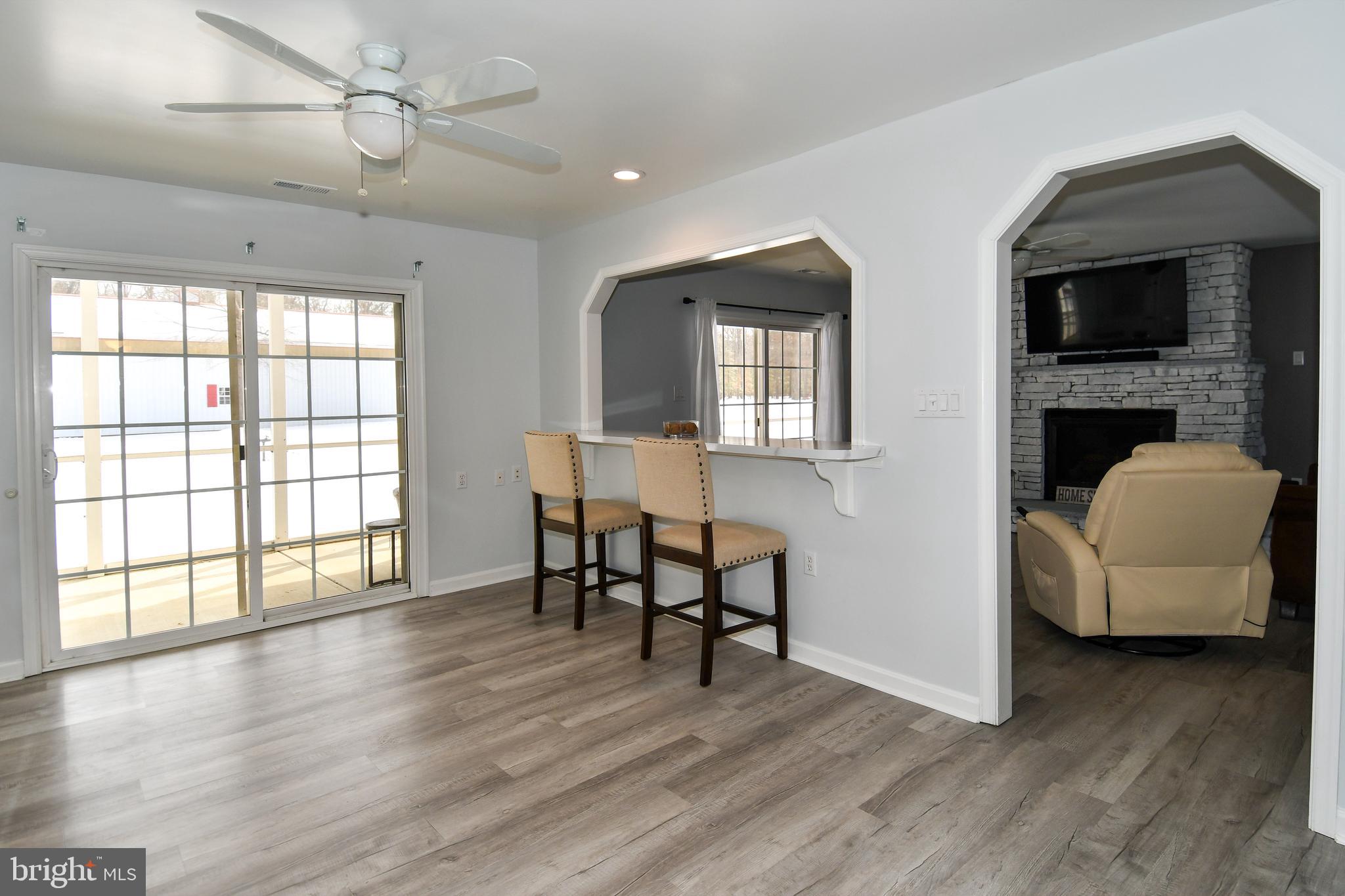 10049 Meleen Drive Faulkner, MD 20632 - Photo 18 of 56 a view of a livingroom with furniture and wooden floor
