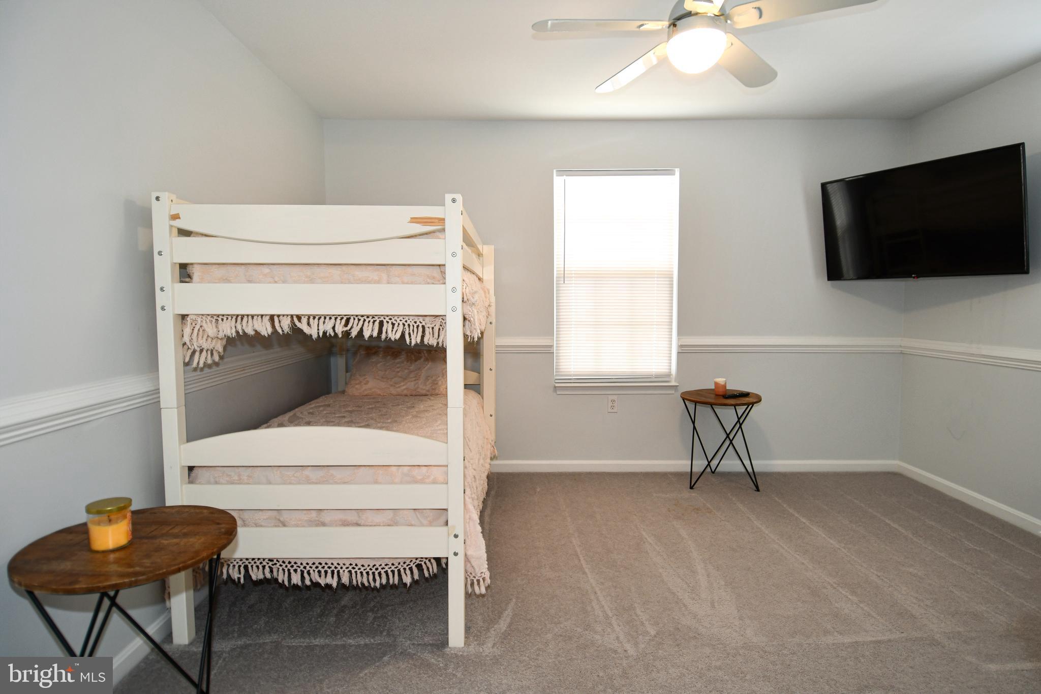 10049 Meleen Drive Faulkner, MD 20632 - Photo 28 of 56 a living room with a flat screen tv and a fireplace