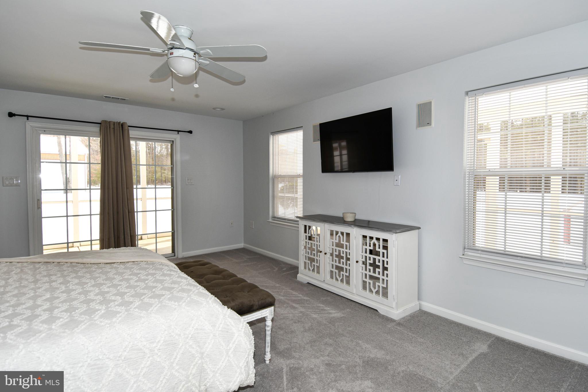 10049 Meleen Drive Faulkner, MD 20632 - Photo 31 of 56 a spacious bedroom with a bed and a flat screen tv