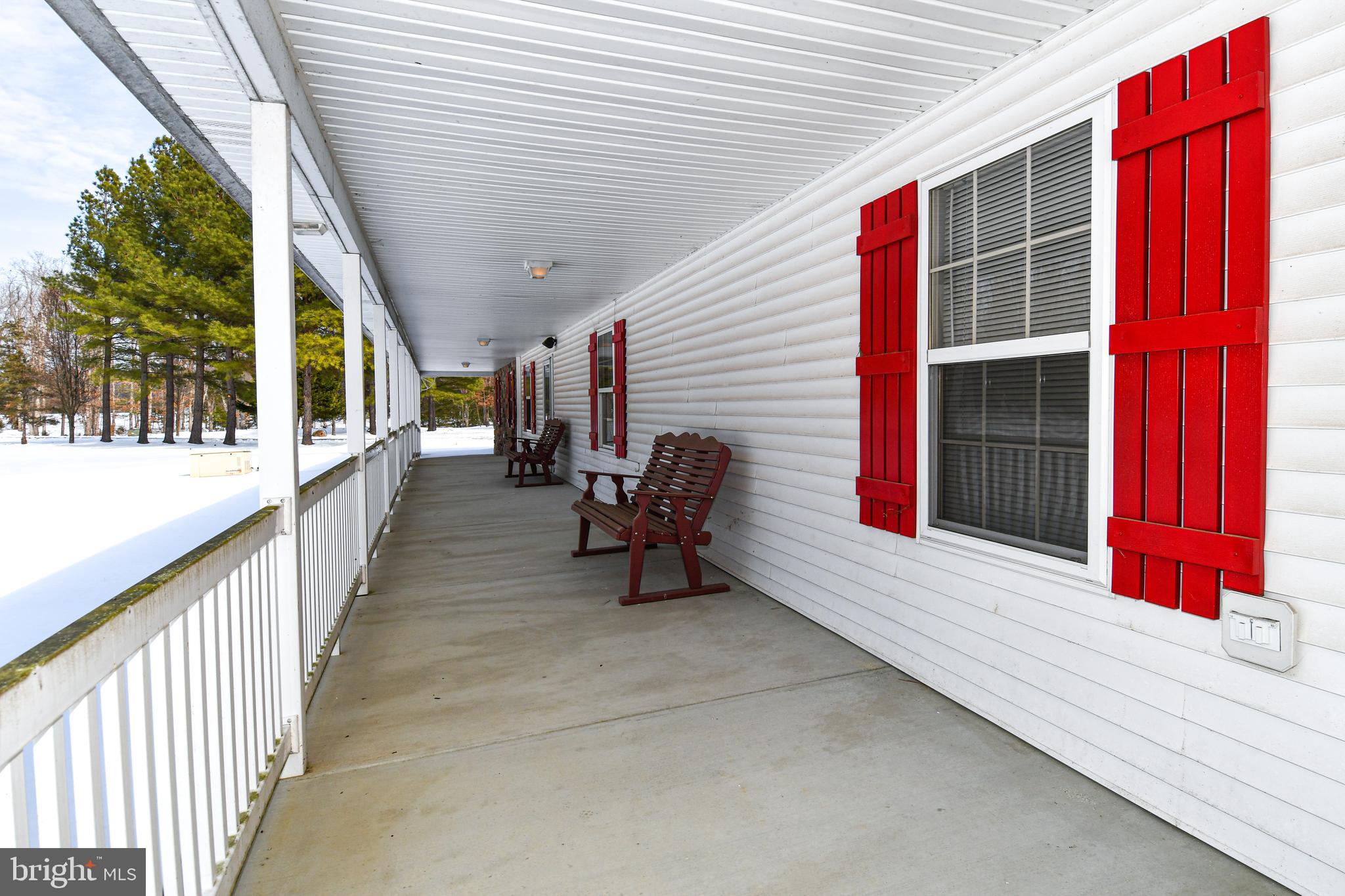 10049 Meleen Drive Faulkner, MD 20632 - Photo 44 of 56 a view of a porch with furniture and floor to ceiling window