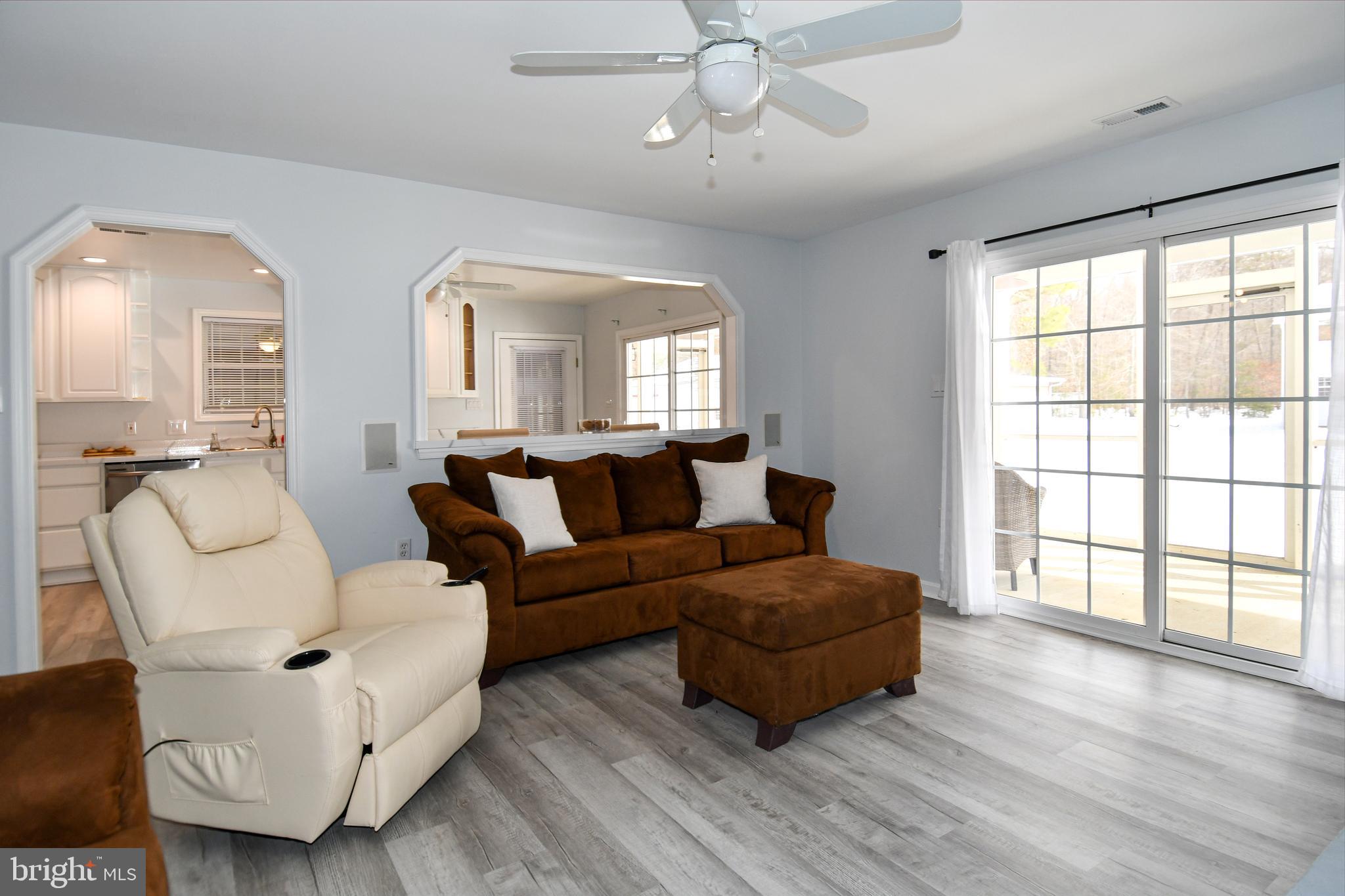 10049 Meleen Drive Faulkner, MD 20632 - Photo 10 of 56 a living room with furniture and a large window