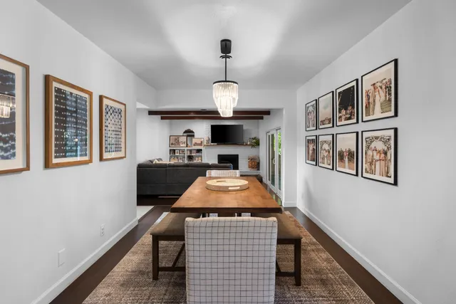 a room with furniture a chandelier and a rug