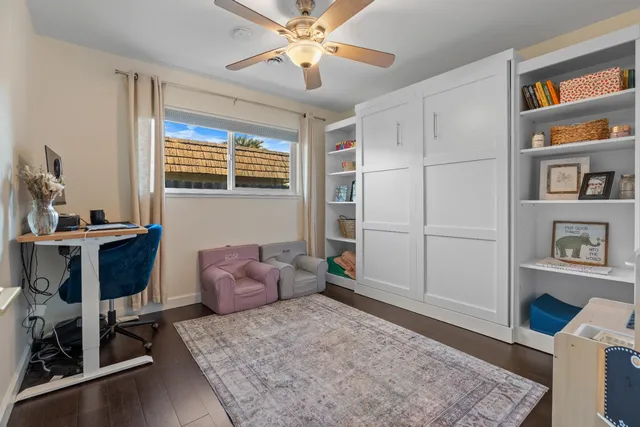 a bedroom with furniture and a window