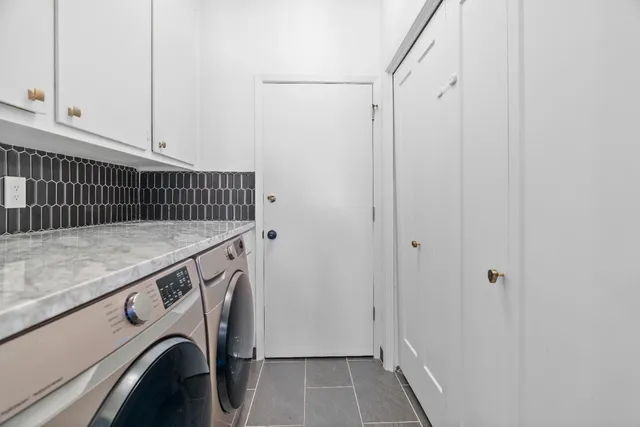a utility room with dryer and washer