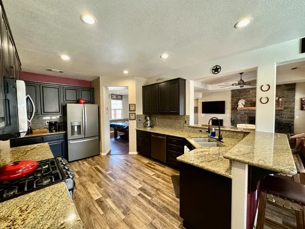 a view of a kitchen from the hallway
