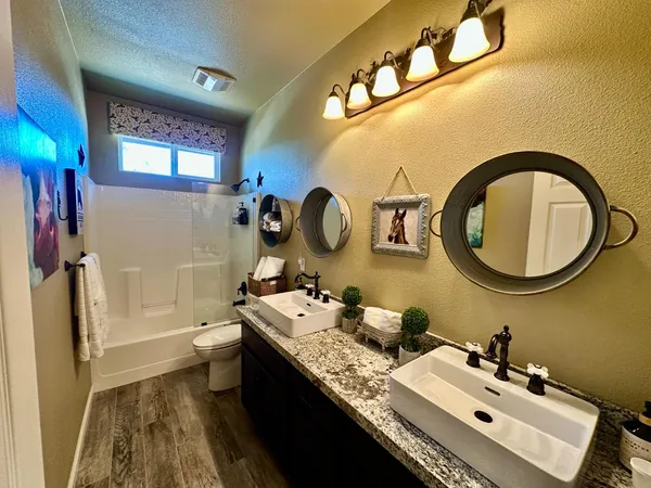 a bath tub sitting in a bathroom next to a window