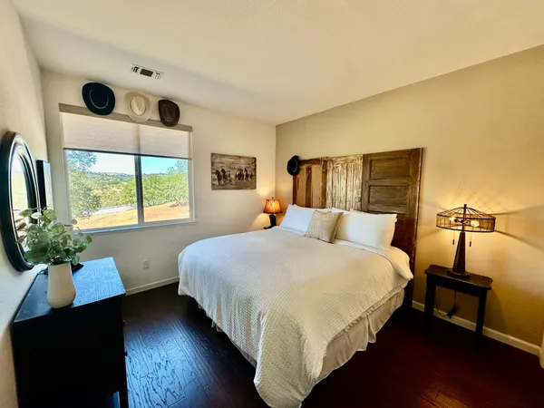 a bathroom with a sink toilet a mirror and tub
