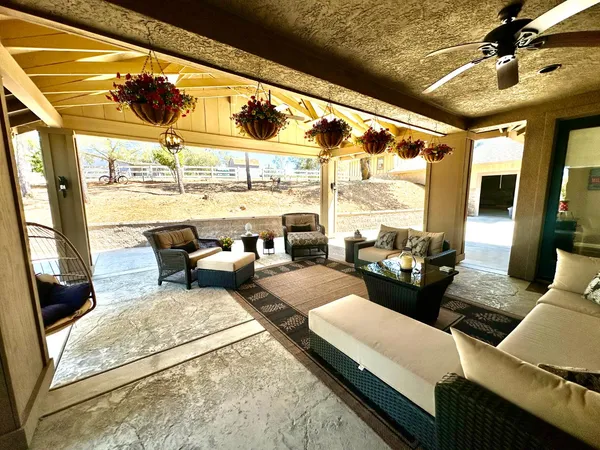a patio with table and chairs