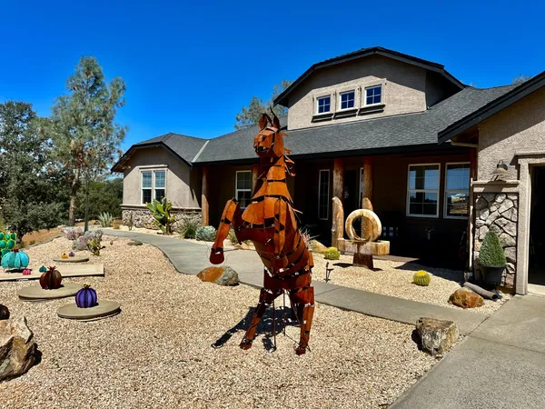 a living room with furniture fireplace and flat screen tv