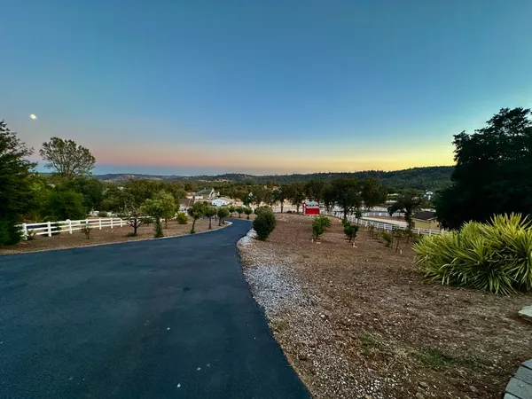 a large kitchen with a large counter top appliances and cabinets