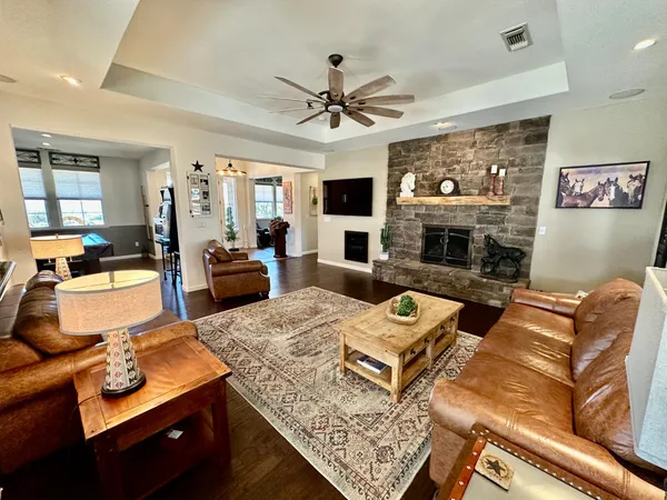 a kitchen with stainless steel appliances kitchen island granite countertop a stove sink and cabinets