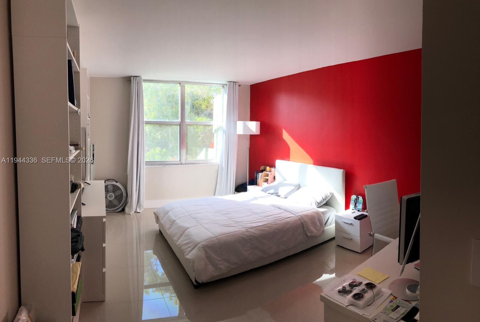 17890 West Dixie Highway, Unit 210 North Miami Beach, FL 33160 - Photo 11 of 19 a bedroom with a bed and a window