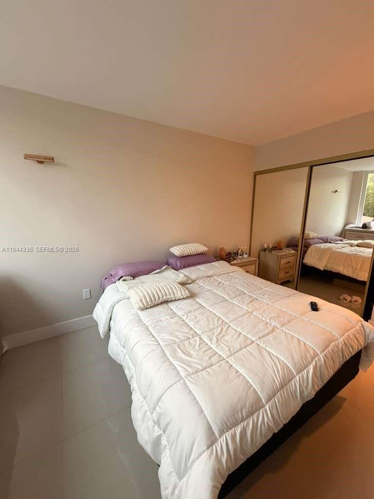 17890 West Dixie Highway, Unit 210 North Miami Beach, FL 33160 - Photo 12 of 19 a bedroom with a bed and window