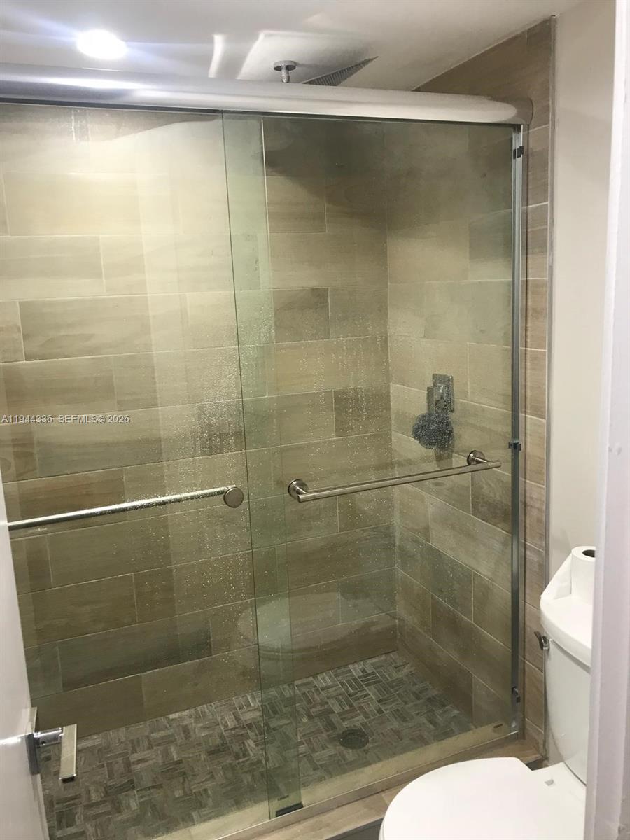 17890 West Dixie Highway, Unit 210 North Miami Beach, FL 33160 - Photo 15 of 19 a bathroom with a shower and toilet