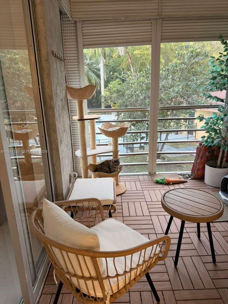 17890 West Dixie Highway, Unit 210 North Miami Beach, FL 33160 - Photo 19 of 19 a outdoor dining space with furniture and outdoor view