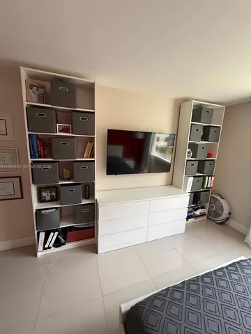 a view of an empty room with shelves