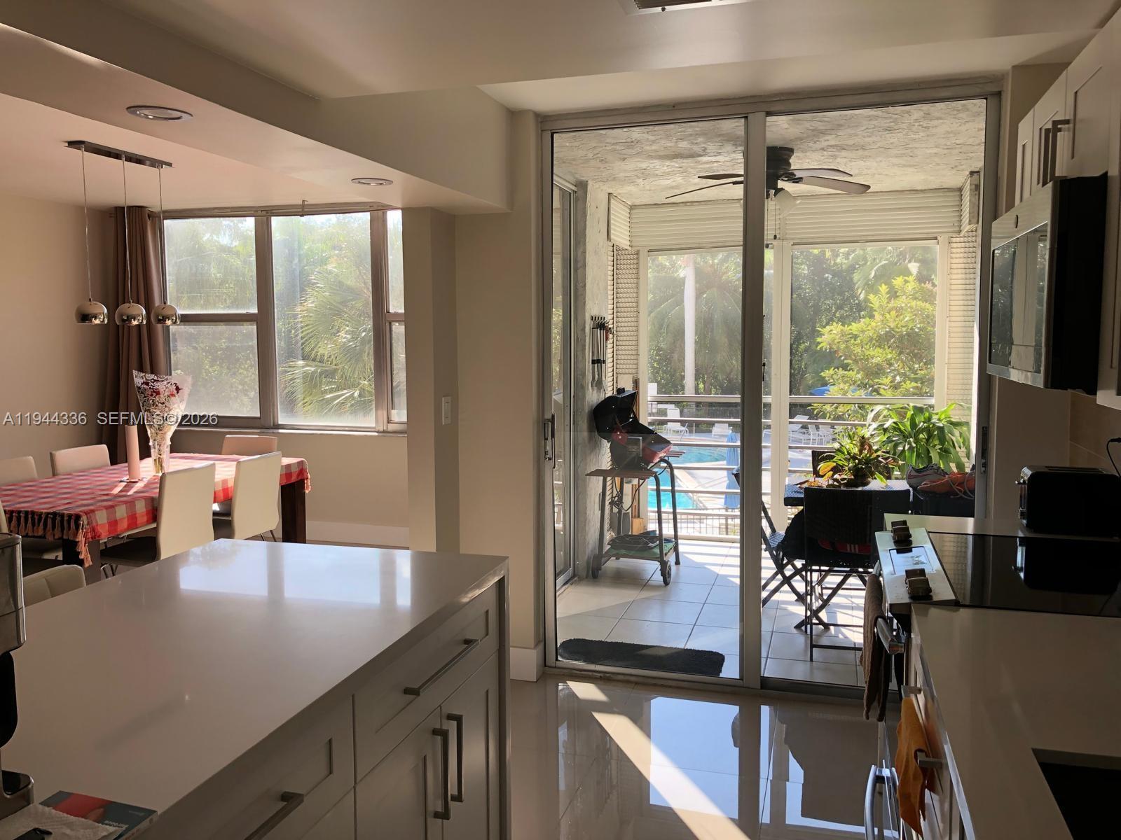 17890 West Dixie Highway, Unit 210 North Miami Beach, FL 33160 - Photo 6 of 19 a view of a living room and dining room