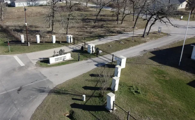 a view of a yard with chairs