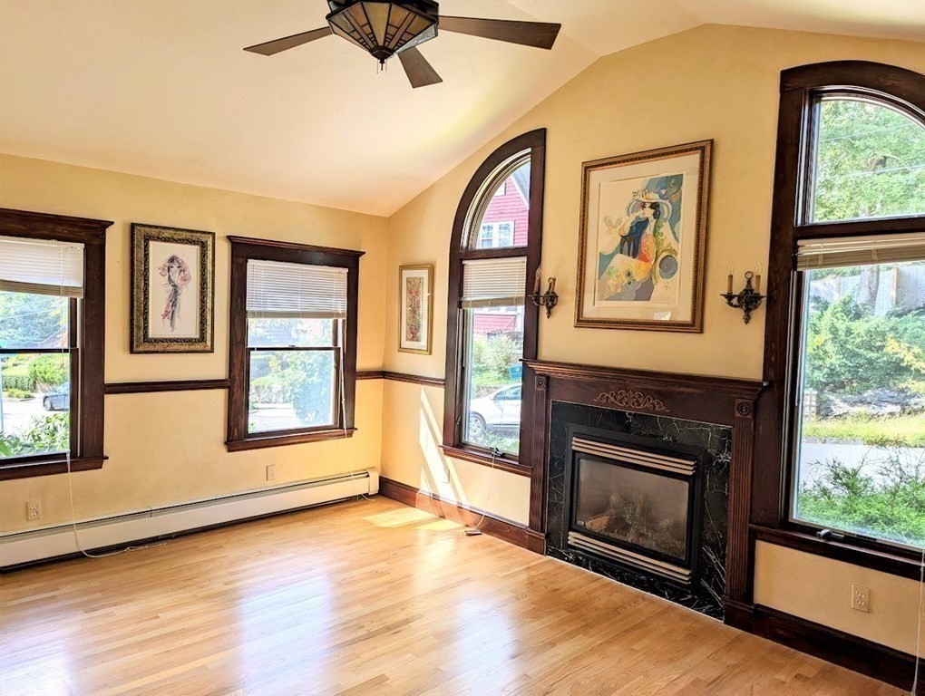 43 Brunswick Road Arlington, MA 02476 - Photo 14 of 42 a view of an empty room with a fireplace and a window