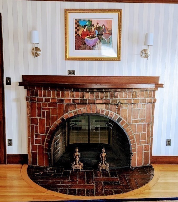 43 Brunswick Road Arlington, MA 02476 - Photo 19 of 42 a closeup of a fireplace with wooden floor