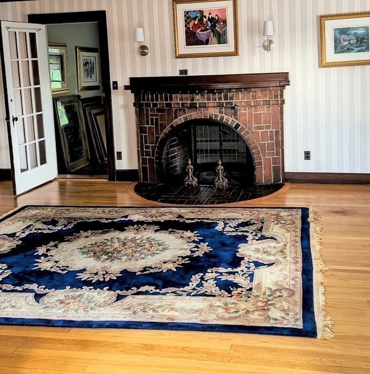 43 Brunswick Road Arlington, MA 02476 - Photo 20 of 42 a stone fireplace with a fireplace