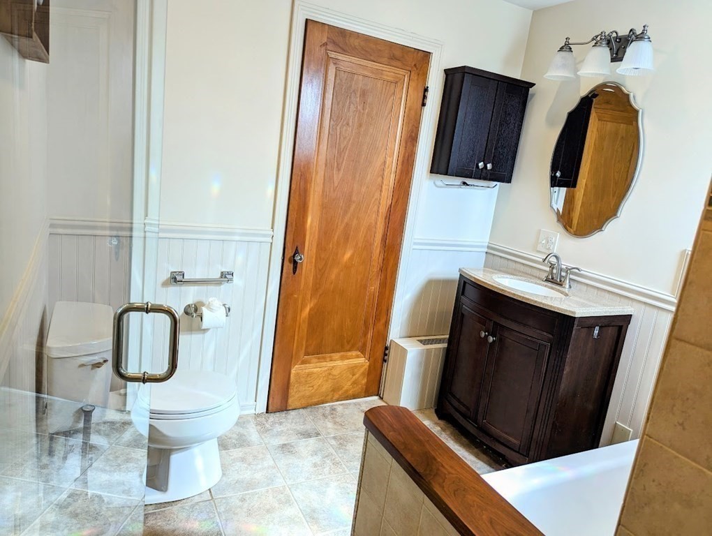 43 Brunswick Road Arlington, MA 02476 - Photo 36 of 42 a bathroom with a sink and a mirror