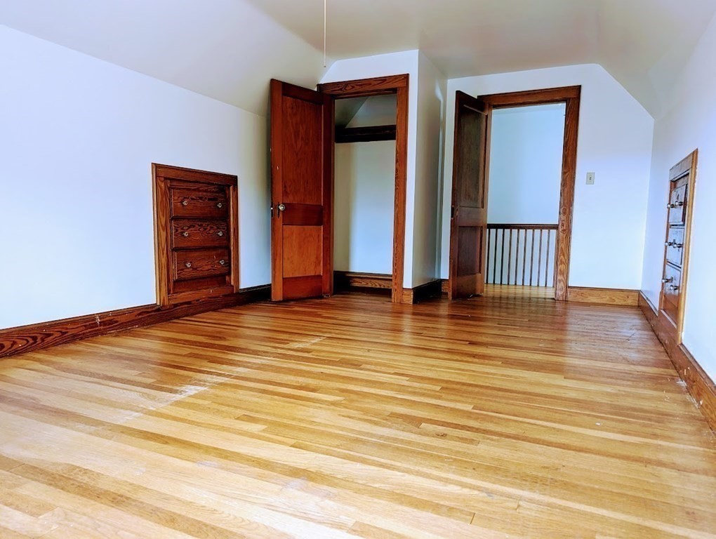 43 Brunswick Road Arlington, MA 02476 - Photo 38 of 42 a view of a room with wooden floor and cabinet
