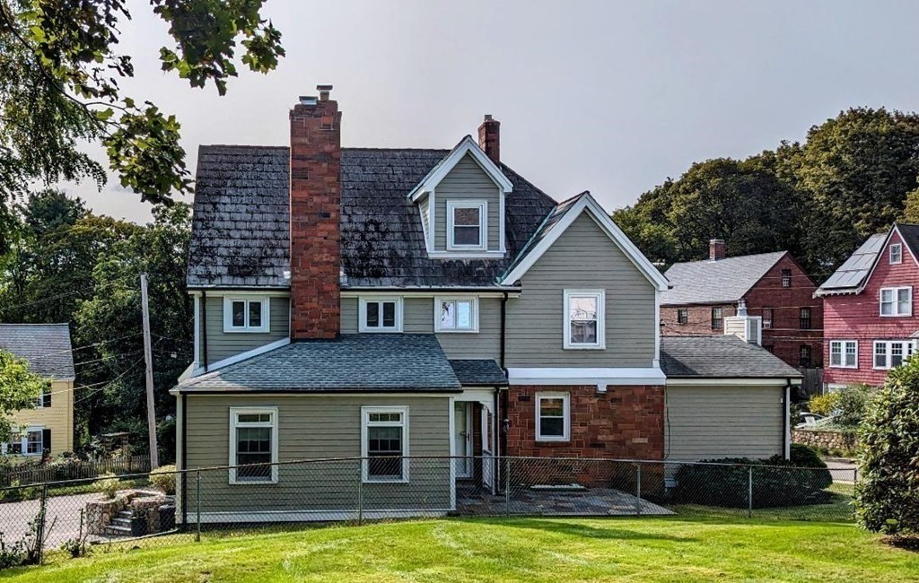 43 Brunswick Road Arlington, MA 02476 - Photo 4 of 42 a front view of a house with a yard and trees