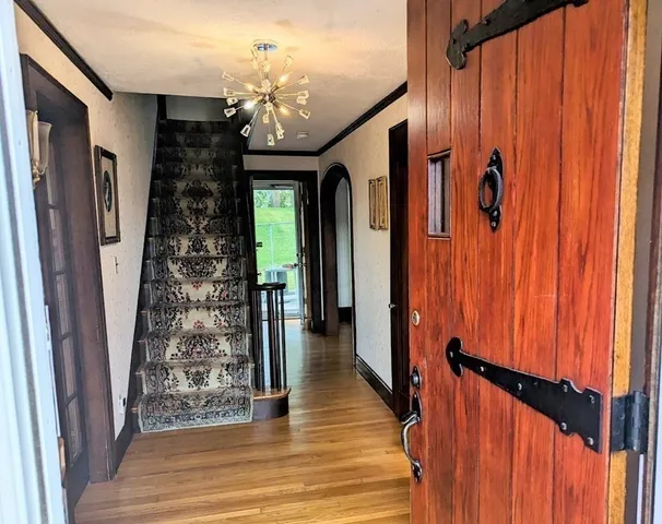 a view of a entryway door with wooden floor