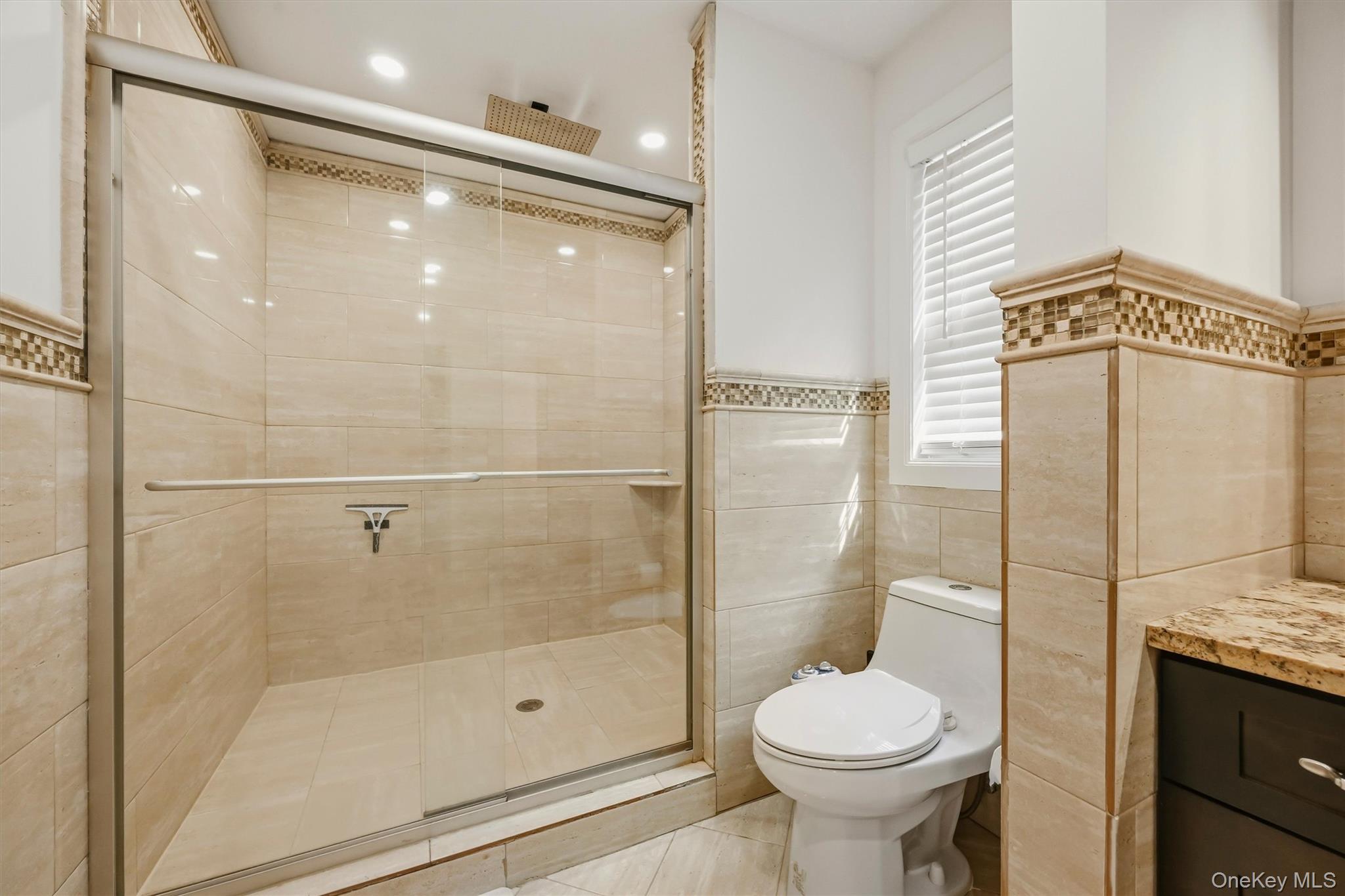 8 Darmstadter Road Bloomingburg, NY 12721 - Photo 25 of 47 Primary bathroom shower with marble tile.
