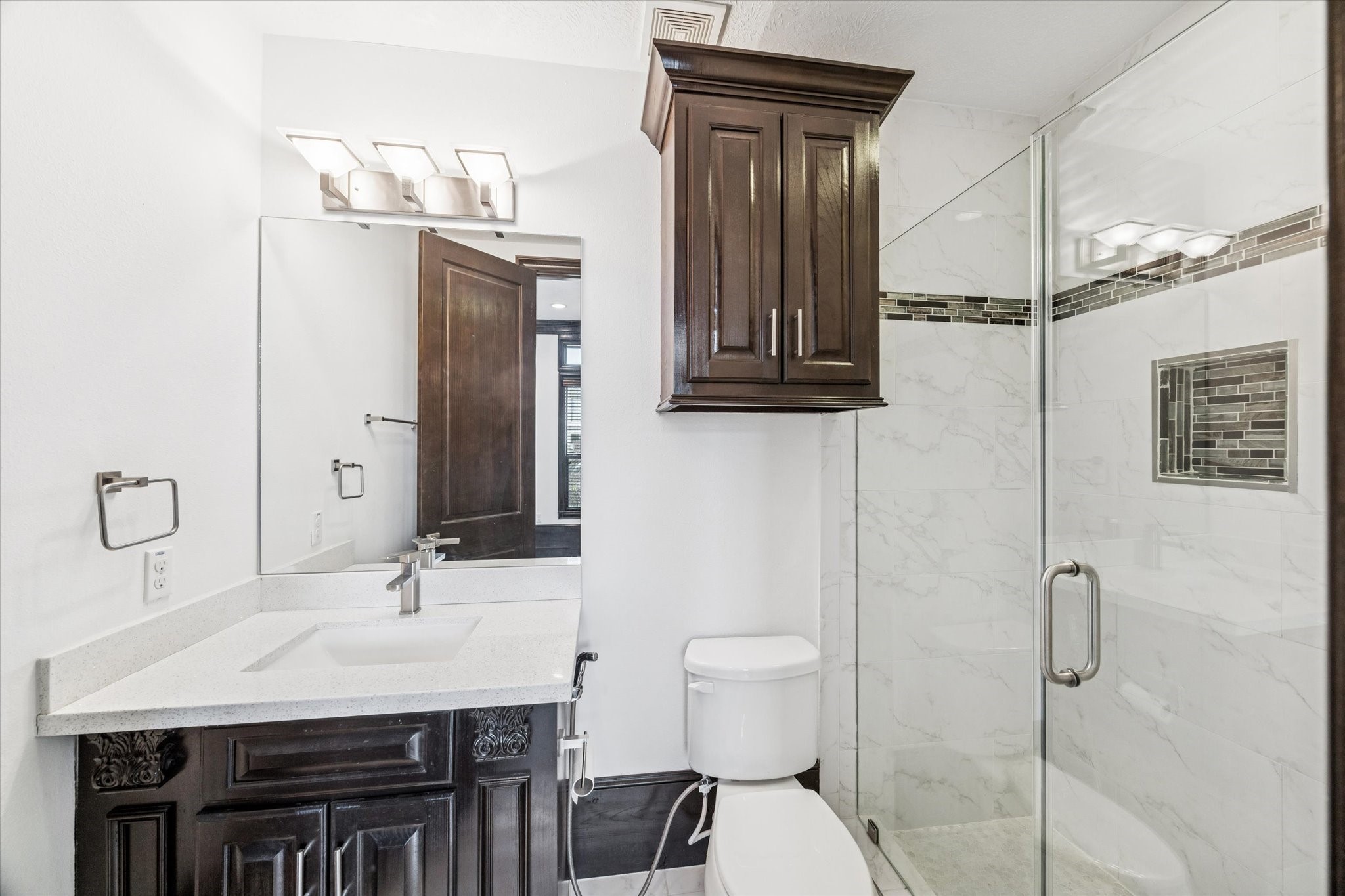3942 Charleston Street Houston, TX 77021 - Photo 5 of 34 a bathroom with a sink a toilet and mirror