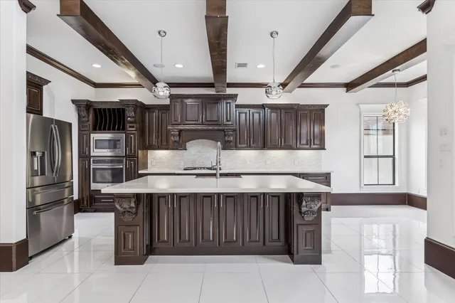 a kitchen with a refrigerator and countertop