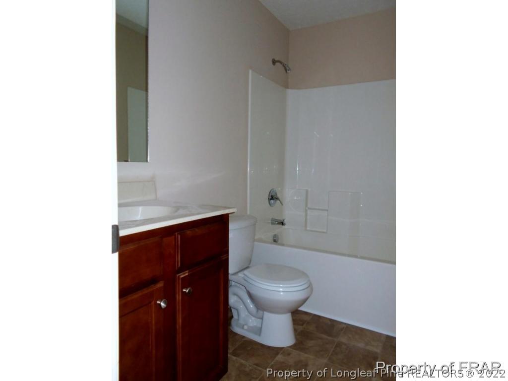 3126 Thrower Road Hope Mills, NC 28348 - Photo 19 of 22 a bathroom with a toilet and a shower