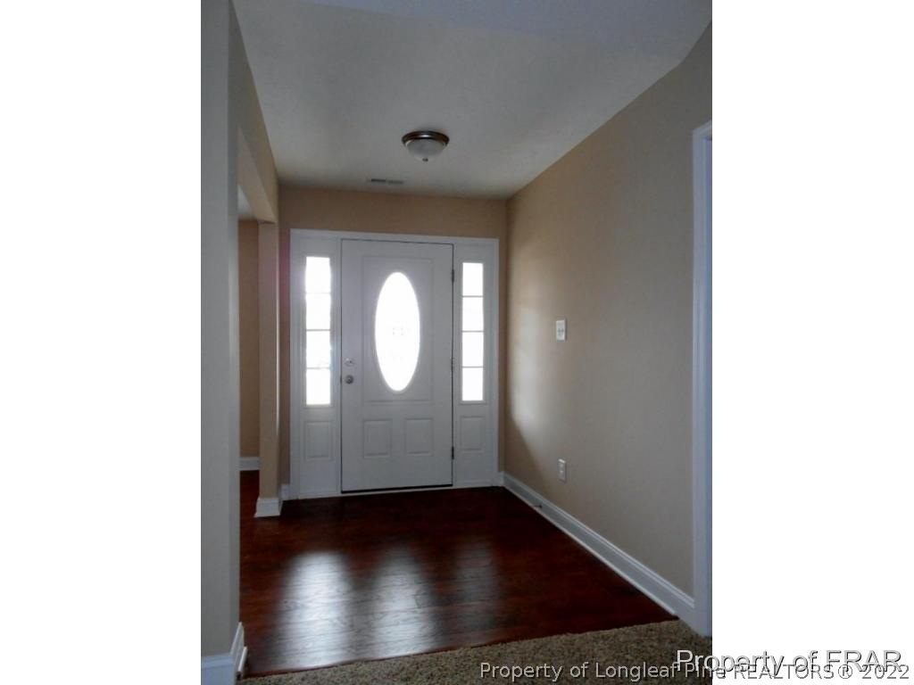 3126 Thrower Road Hope Mills, NC 28348 - Photo 2 of 22 a view of a room with wooden floor