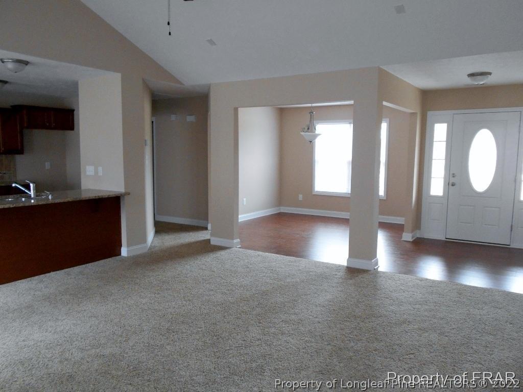 3126 Thrower Road Hope Mills, NC 28348 - Photo 5 of 22 a view of a hallway with wooden floor