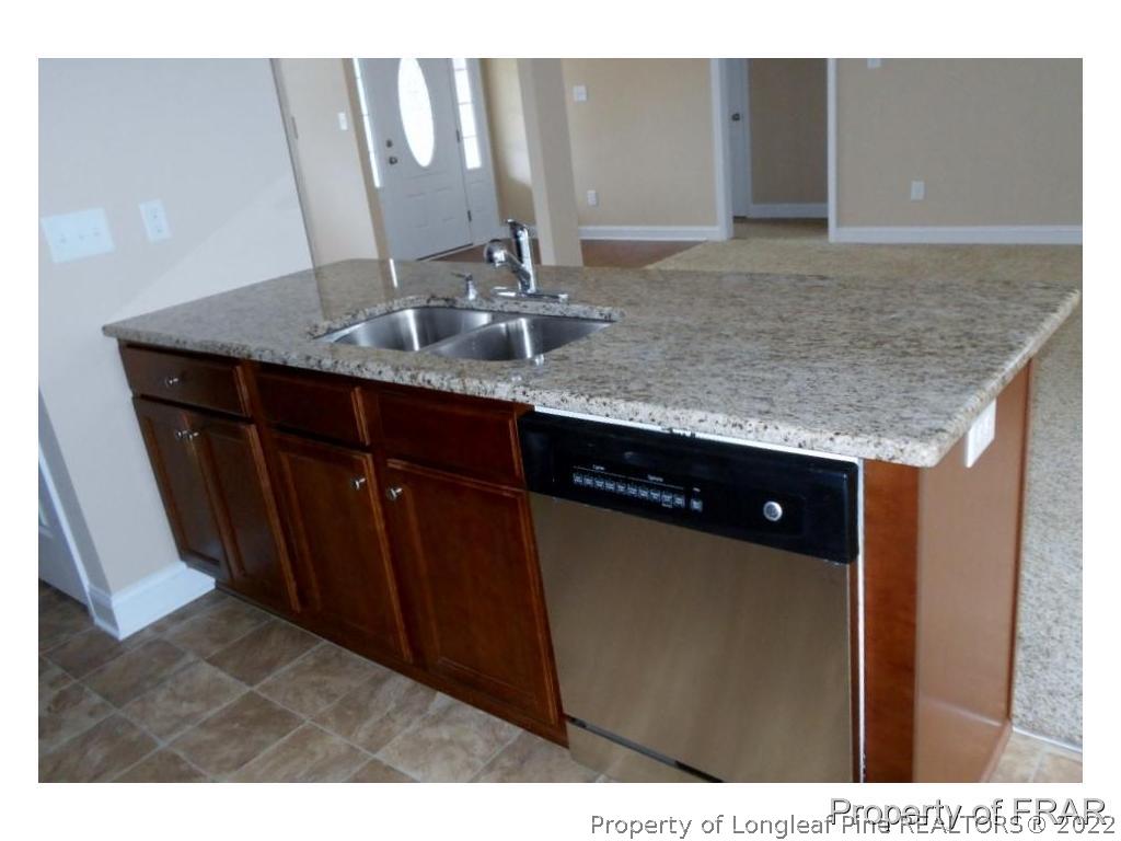 3126 Thrower Road Hope Mills, NC 28348 - Photo 8 of 22 a bathroom with a granite countertop sink and a mirror