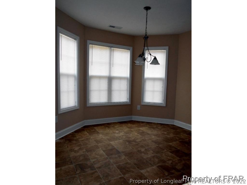 3126 Thrower Road Hope Mills, NC 28348 - Photo 10 of 22 a view of an empty room with a window