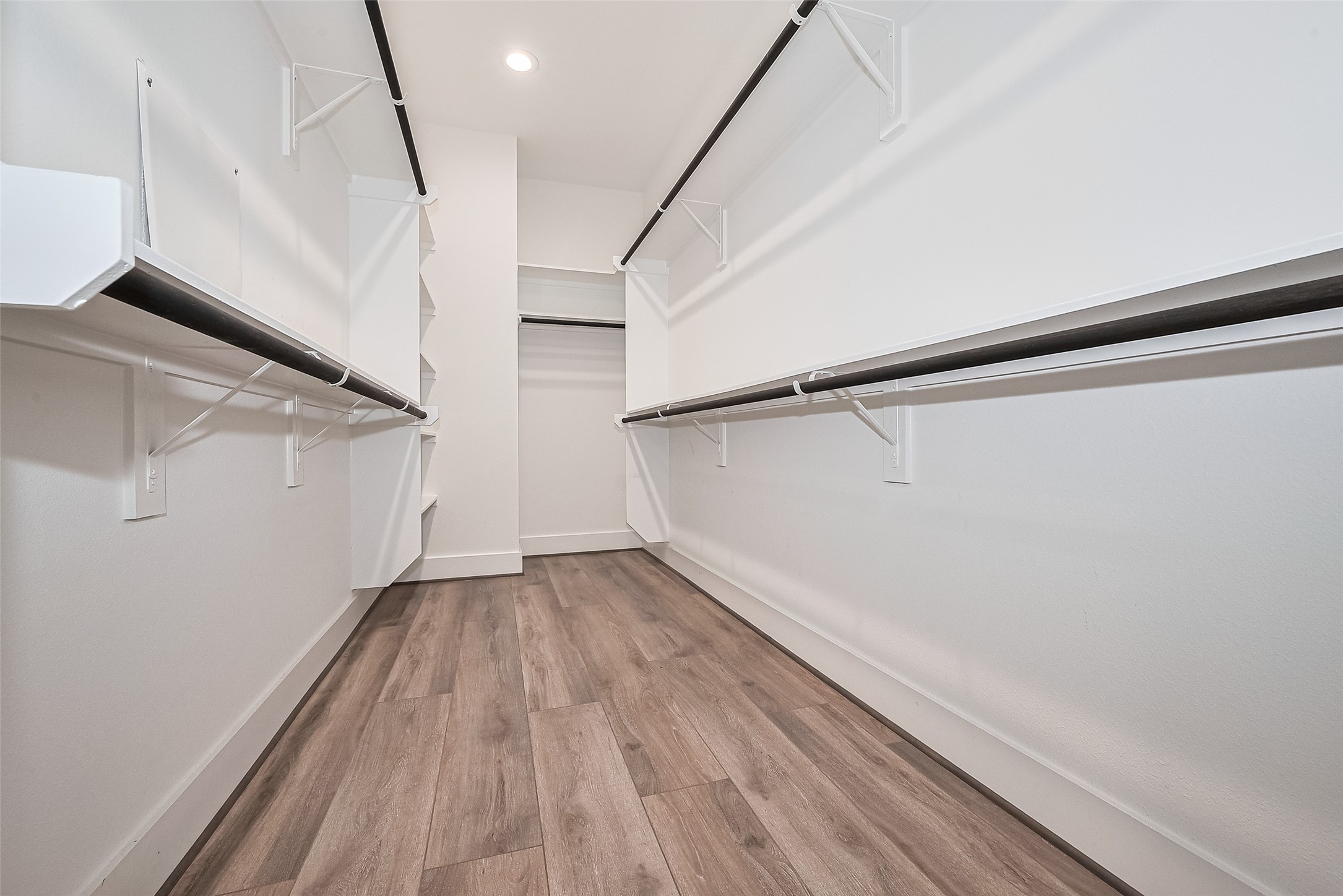 3510 Hadley Street Houston, TX 77004 - Photo 45 of 48 This full entry closet offers thoughtfully arranged shelving, multiple hanging rods, and ample space for seamless organization of your entire wardrobe.